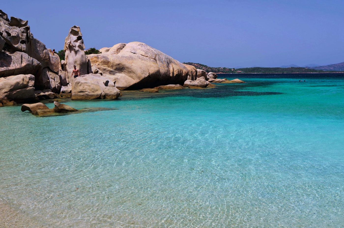Turquoise water over pale sand on a Sardinian beach